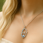 Anhänger Korallenast, Seestern, blauem Topas, Larimar